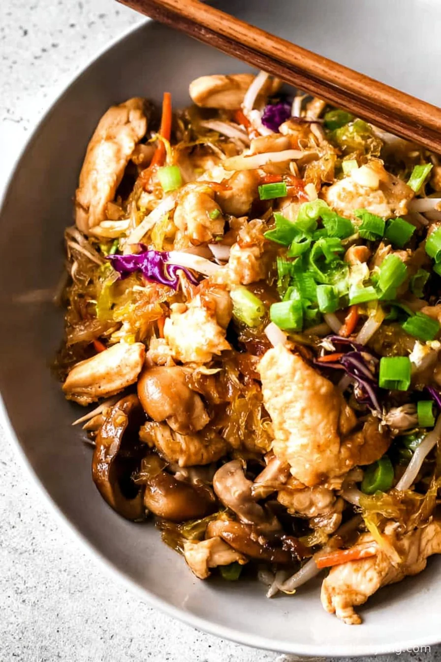 Tender chicken tossed with crisp veggies and eggs, ready to wrap in Mandarin pancakes